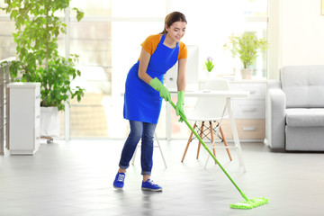 Canvas Print - Woman cleaning floor with mop indoors