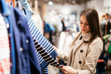 Wall Mural - Beautiful brunette buying clothes