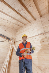 Poster - Senior minority construction worker on the job site