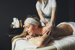 © NDABCREATIVITY - Massage therapist massaging woman