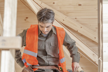 Wall Mural - Contractor operating a power tool