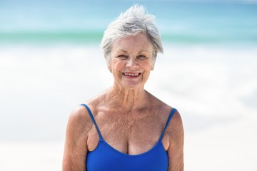 Wall Mural - Mature woman posing in swimsuit