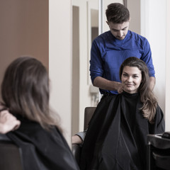 Wall Mural - Male hairdresser and attractive woman