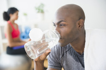 Close Up Of Man Drinking Water Bottle