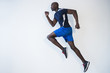 © JGI/Jamie Grill/Blend Images - Side view of Black man running