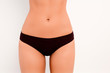 © deagreez - close up photo of girl's bikini area with black panties