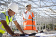 © Resolution Productions/Blend Images - Architects working at construction site