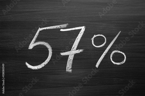 Fotografie, Obraz 57 percent header written with a chalk on the blackboard