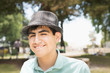 © Sollina Images/Blend Images - Hispanic teenage boy smiling in park