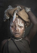 © ac productions/Blend Images - Portrait of girl in tribal face paint