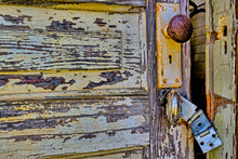 Old, Rustic, Partially Open Door With Broken Latch