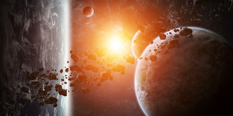 sunrise over group of planets in space