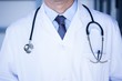 © WavebreakMediaMicro - Male doctor in lab coat wearing stethoscope around neck