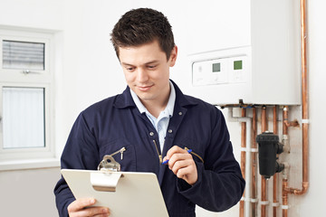 Poster - Male Plumber Working On Central Heating Boiler
