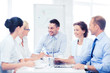 © Syda Productions - business team having meeting in office
