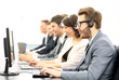 © ASDF - Attractive young man working in a call center with his colleagues