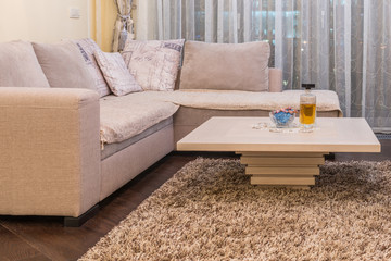 Low angle view of coffee table and white sofa