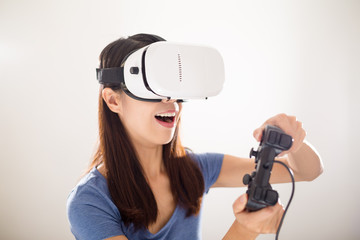 Wall Mural - Woman play the video game with vr device