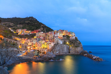 Sunset in Manarola.Manarola  is a small town, in the province of La Spezia, Liguria, northern Italy. It is the second smallest of the famous Cinque Terre towns frequented by tourists.