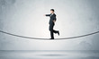 © ra2 studio - Sales guy balancing on tight rope