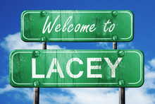 Lacey Vintage Green Road Sign With Blue Sky Background