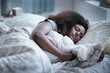 © JGI/Tom Grill/Blend Images - Woman sleeping in bed