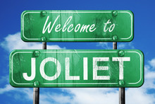 Joliet Vintage Green Road Sign With Blue Sky Background