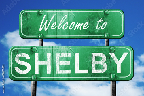 Fotomural shelby vintage green road sign with blue sky background