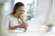 © JGI/Tom Grill/Blend Images - Senior woman using a laptop while sitting at home