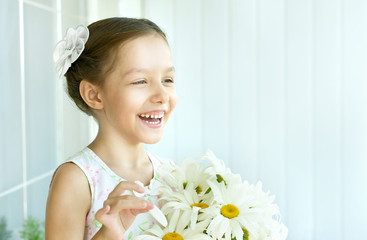 Wall Mural - little girl with dasies flowers