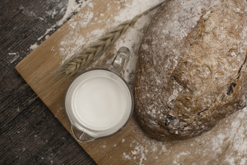 wheat flour with a fresh  hot bread   and milk