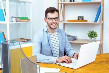 IT programmer working with laptop