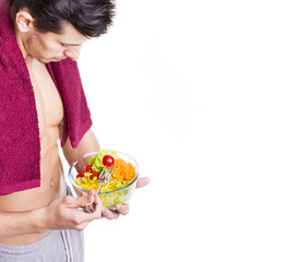 Wall Mural - Fit young man holding a bowl of salad, isolated on white backgro