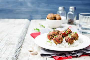 Eggplant white beans vegan meatballs with tomato sauce and rice