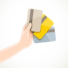 Female Hand Holding Three Credit Cards Gold, Platinum And Normal