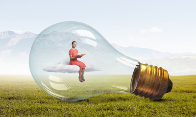Wall Mural - woman in electric bulb