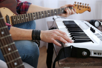 Poster - Man with guitar and synthesizer closeup