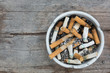 © sutichak - cigarette stub in ashtray