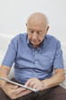 Old man using a Tablet