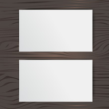 White Blank Card On A Wooden Background,