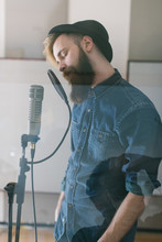 Hipster Man Singing In A Studio