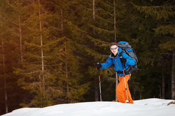 Wall Mural - Hiker in winter mountains