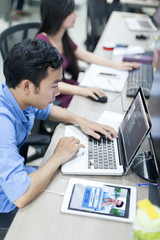Wall Mural - asian software developer using laptop computer