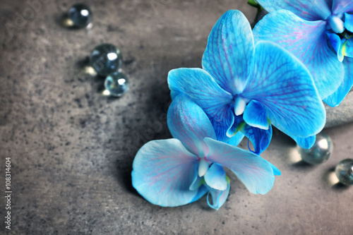 Fototapeta na wymiar Beautiful spa composition with blue orchid and stones