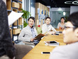 © imtmphoto - group of young asian business people meeting in office