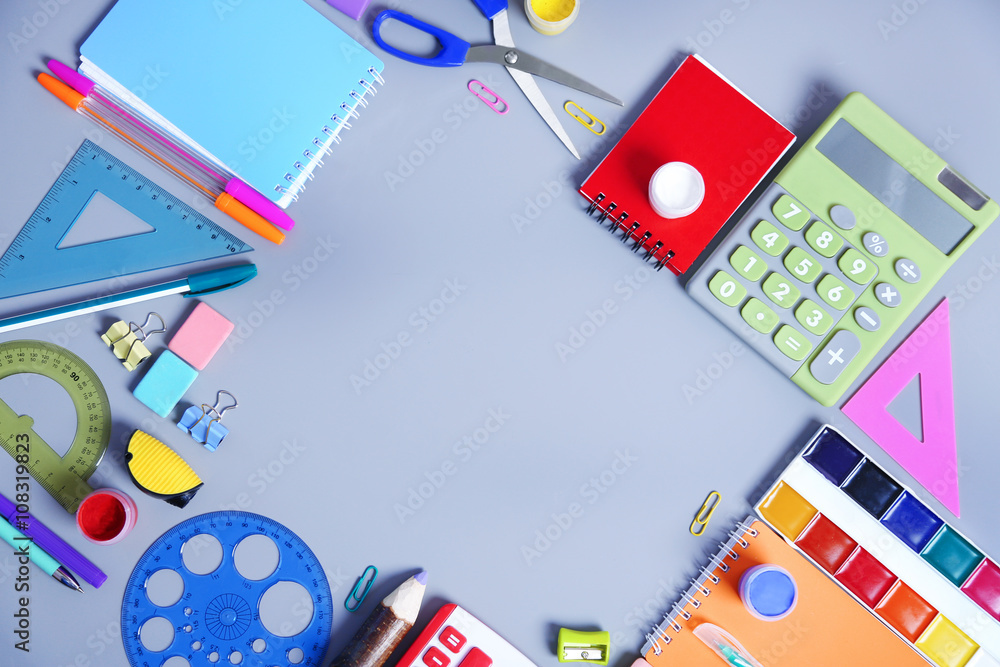 Set of stationery on grey table, top view