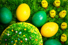 Easter Celebrating Cake On Green Grass With Yellow Toy Chickens