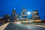 Fototapeta  - Modern buildings and traffic trails in downtown Melbourne