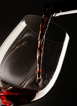 Glass With Red Wine On Dark Background