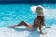© lena_pausa - Girl in the swimming pool in the white hat